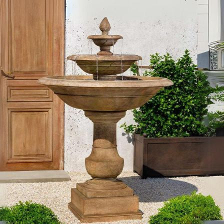 Savannah fountain on pebbles against door featured image