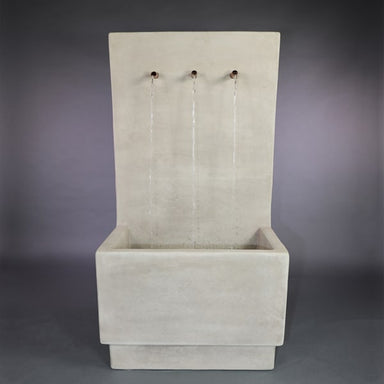 Alta Tribus Wall Fountain in action against gray background.
