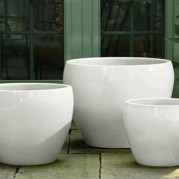 Cabachon Planter - Coco - S/3 on concrete in the backyard
