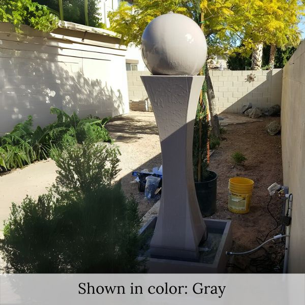 I Fountain with Ball in gray color in the backyard.