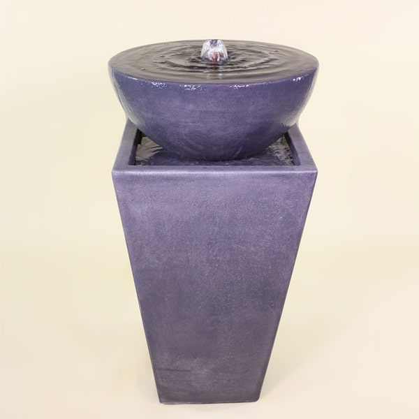 Tapered Zen Fountain in action against brown background.
