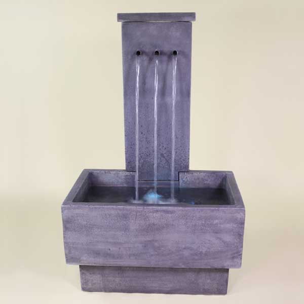 Tre Rame Fountain in action against brown background.