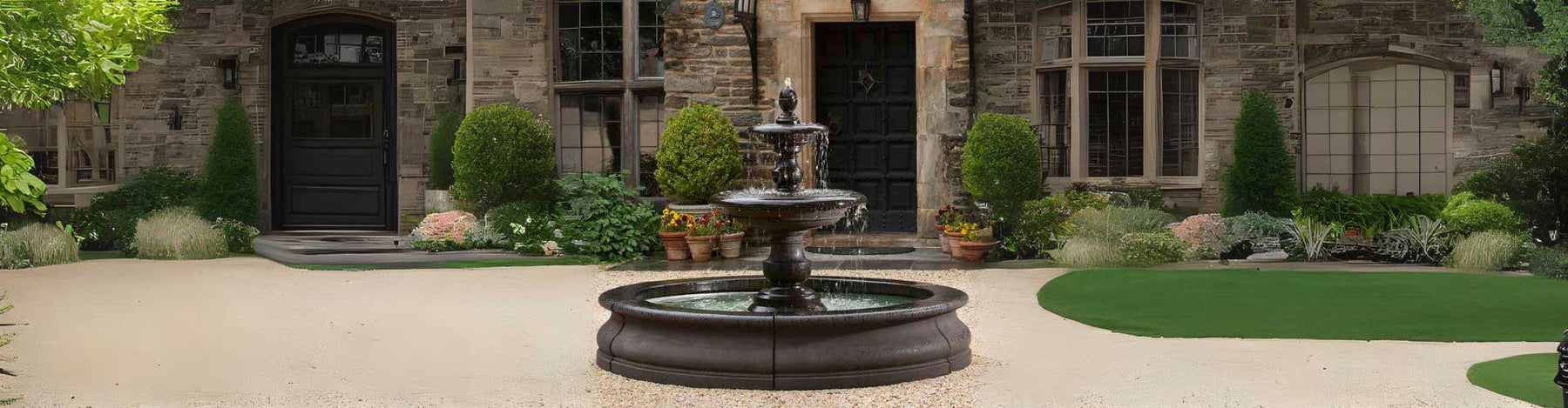 Caterina Fountain in basin in action in front of house