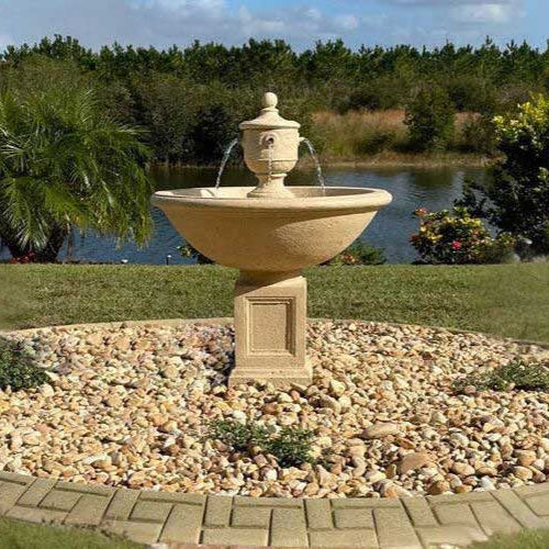 Rochefort fountain in action on white pebbles