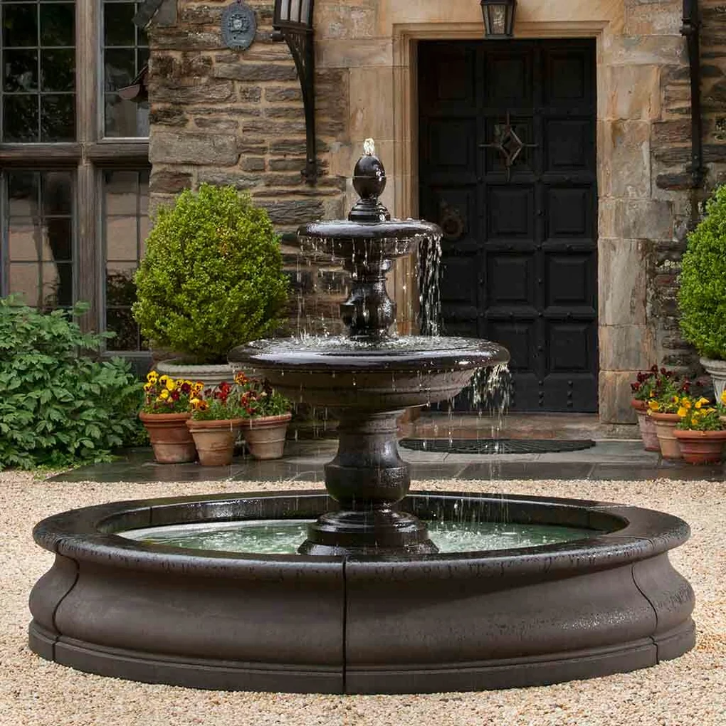 Caterina Fountain in Basin at elegant stone home entrance