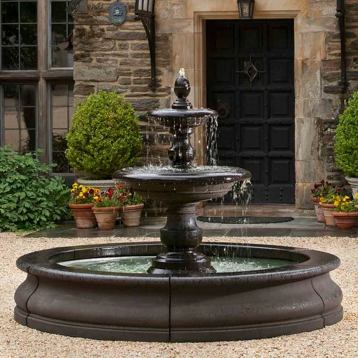 Caterina Fountain in Basin at elegant stone home entrance