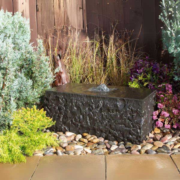 Basalt Fountain collection image of shizukesa fountain kit on mixed pebbles in action.