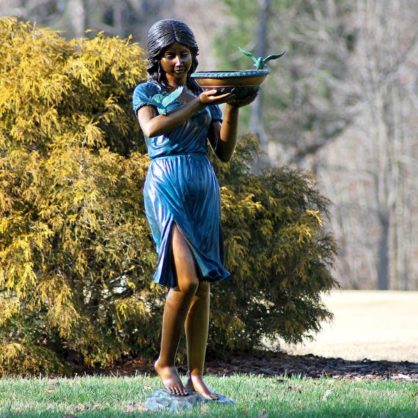 Bronze Fountains Collection Image Bronze Girl with Birdbath Fountain Sculpture in the backyard.