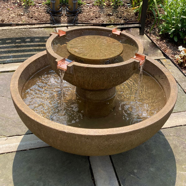 Campania International Collection Image of 29 inch Del Rey Fountain in aged limestone in action on patio.