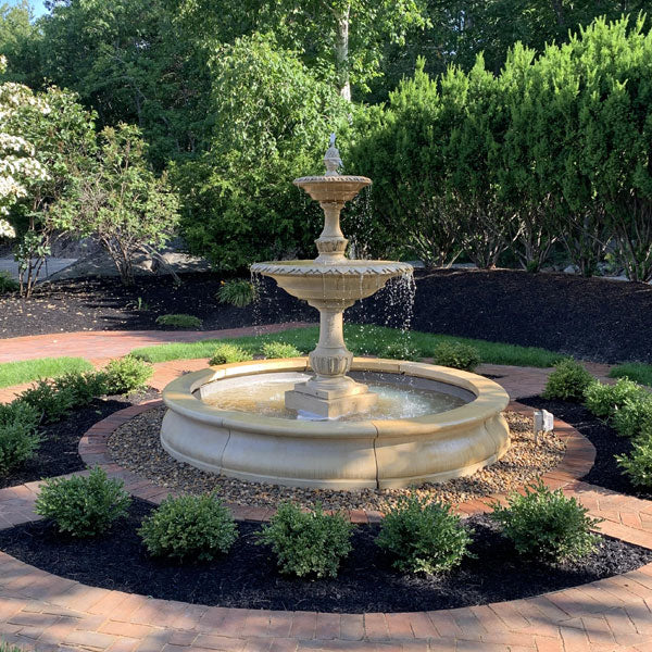 Charleston Fountain in Basin on gravel against green trees