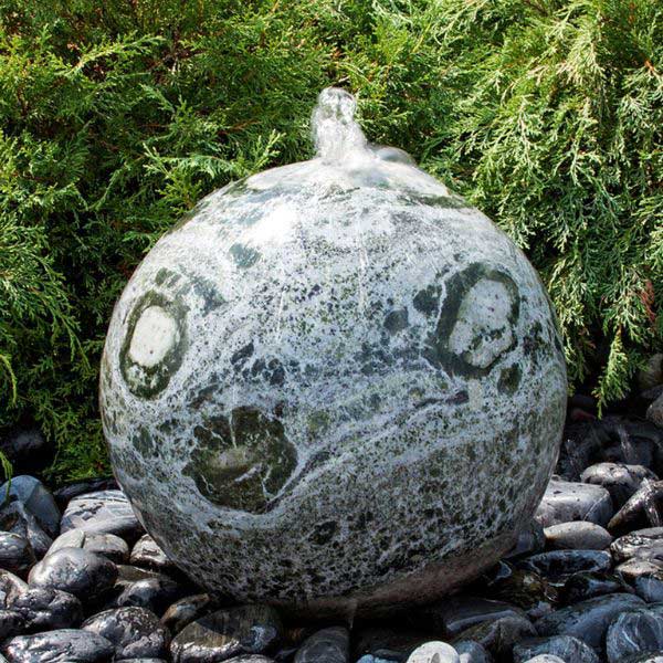 Marble Fountains Collection Image of 16 inch green marble sphere fountain in the backyard.