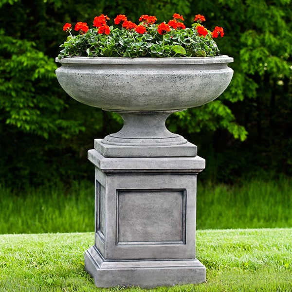 St. Louis Planter on pedestal filled with red flowers