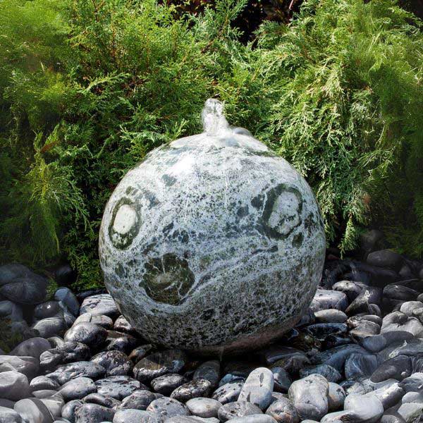 20 Inch Green Marble Sphere Fountain on black pebbles in action