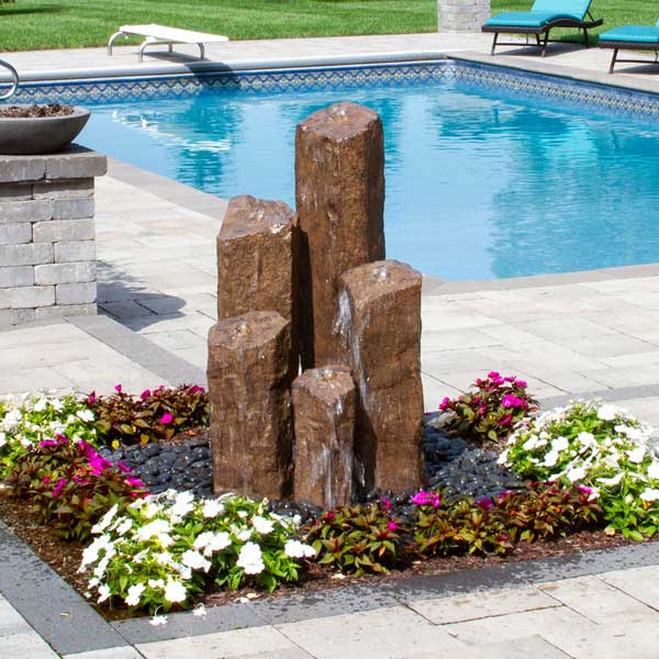 5 Column Handcrafted Basalt Kit in Chestnut near swimming pool