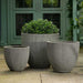 Airy Planter, Large - Ash Grey lite on concrete filled with plants