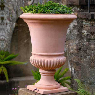 Alberobello Urn Planter - Terra Cotta - S/1 on top of the concrete in the garden