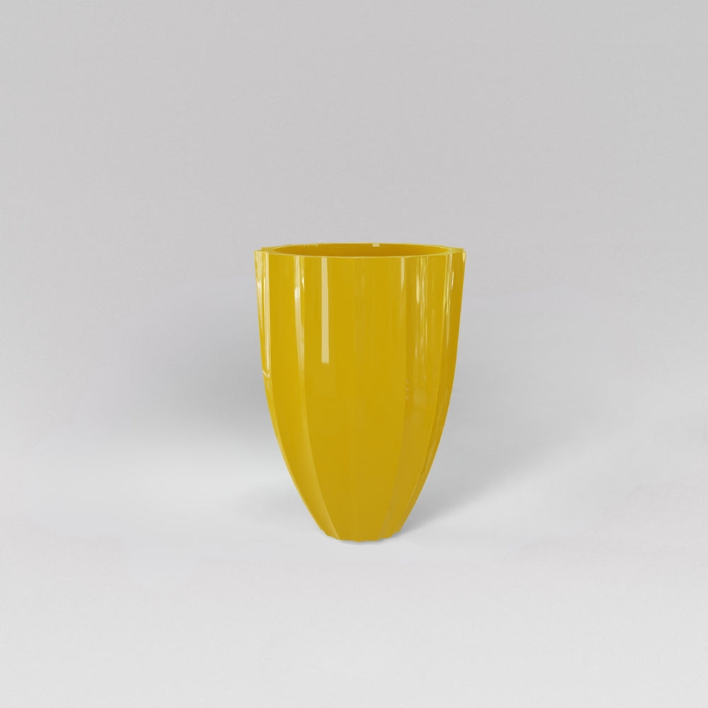 Alicante Tapered Fluted Round Fiberglass Planter in gloss saffron against gray background.