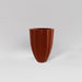 Alicante Tapered Fluted Round Fiberglass Planter in matte terra cotta against gray background.