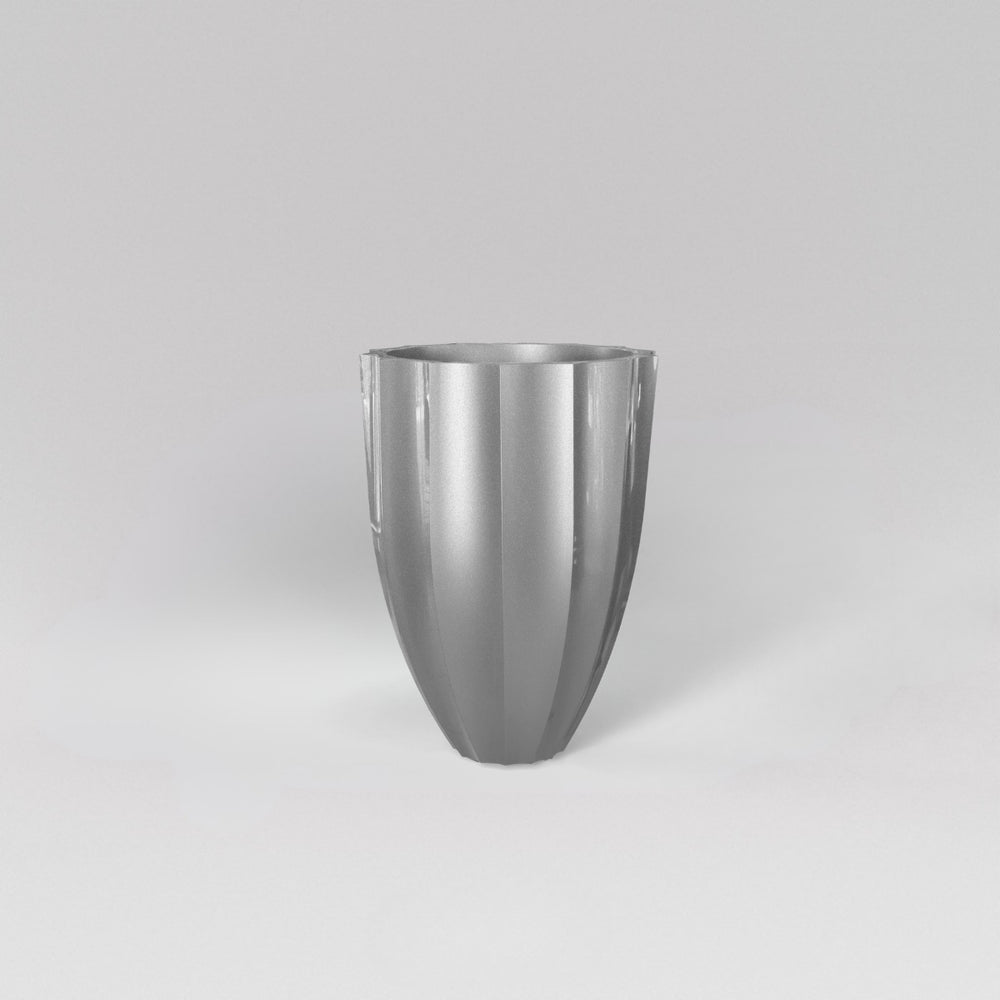 Alicante Tapered Fluted Round Fiberglass Planter in metallic silver against gray background.