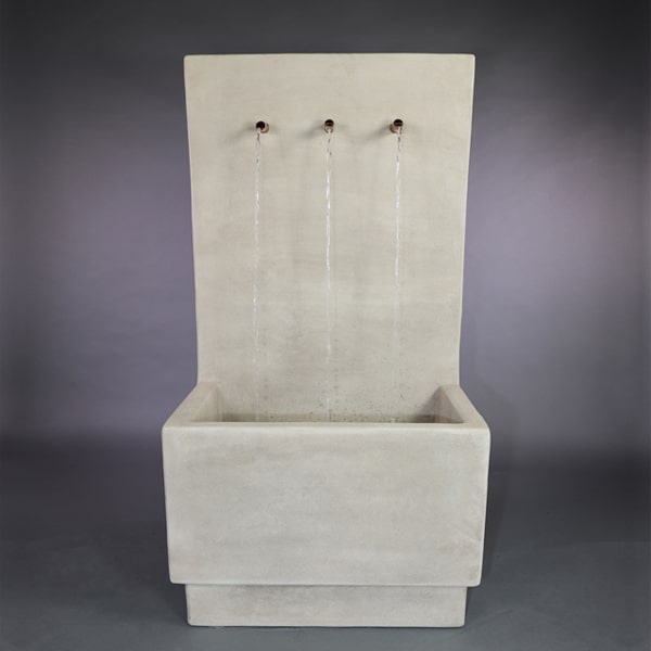 Alta Tribus Wall Fountain in action against gray background.