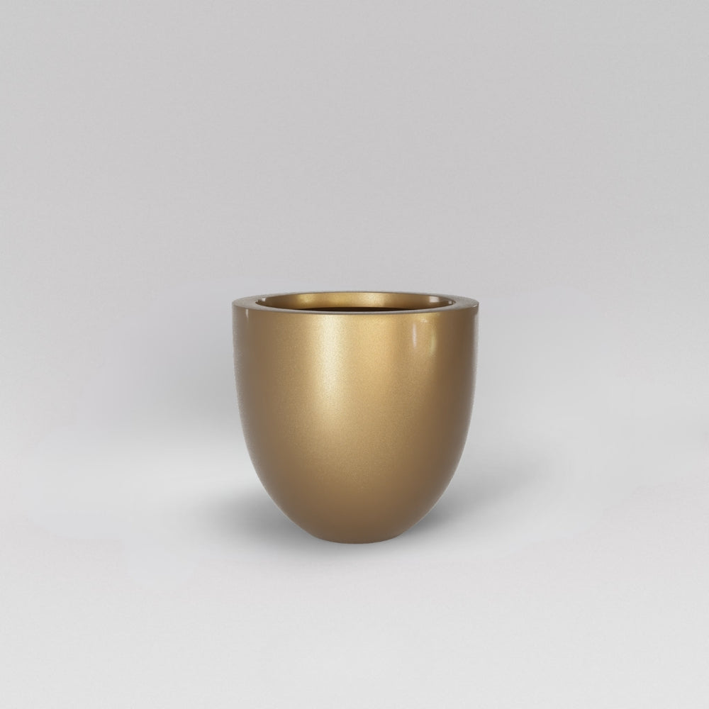 Alzira Round Fiberglass Planter in gloss metallic gold against gray background.