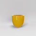 Alzira Round Fiberglass Planter in gloss saffron against gray background.