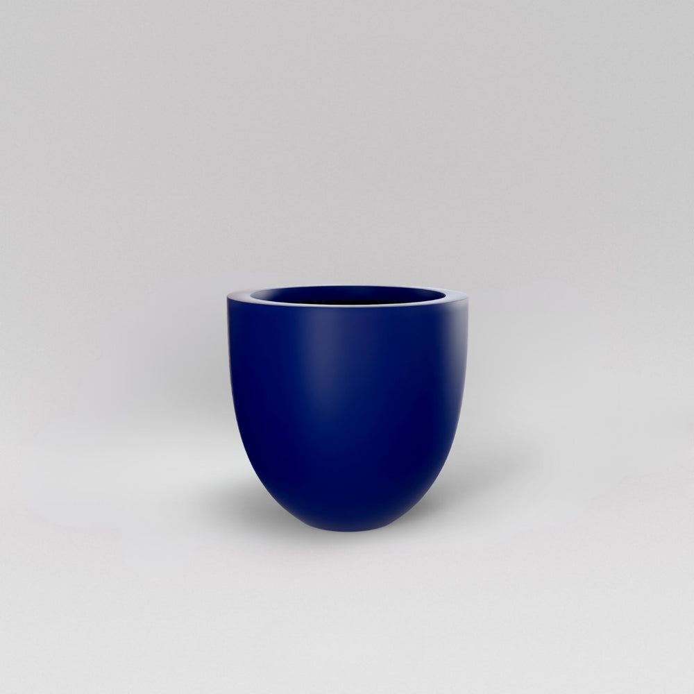 Alzira Round Fiberglass Planter in matte cobalt blue against gray background.