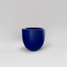 Alzira Round Fiberglass Planter in matte cobalt blue against gray background.