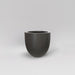 Alzira Round Fiberglass Planter in matte gunmetal against gray background.