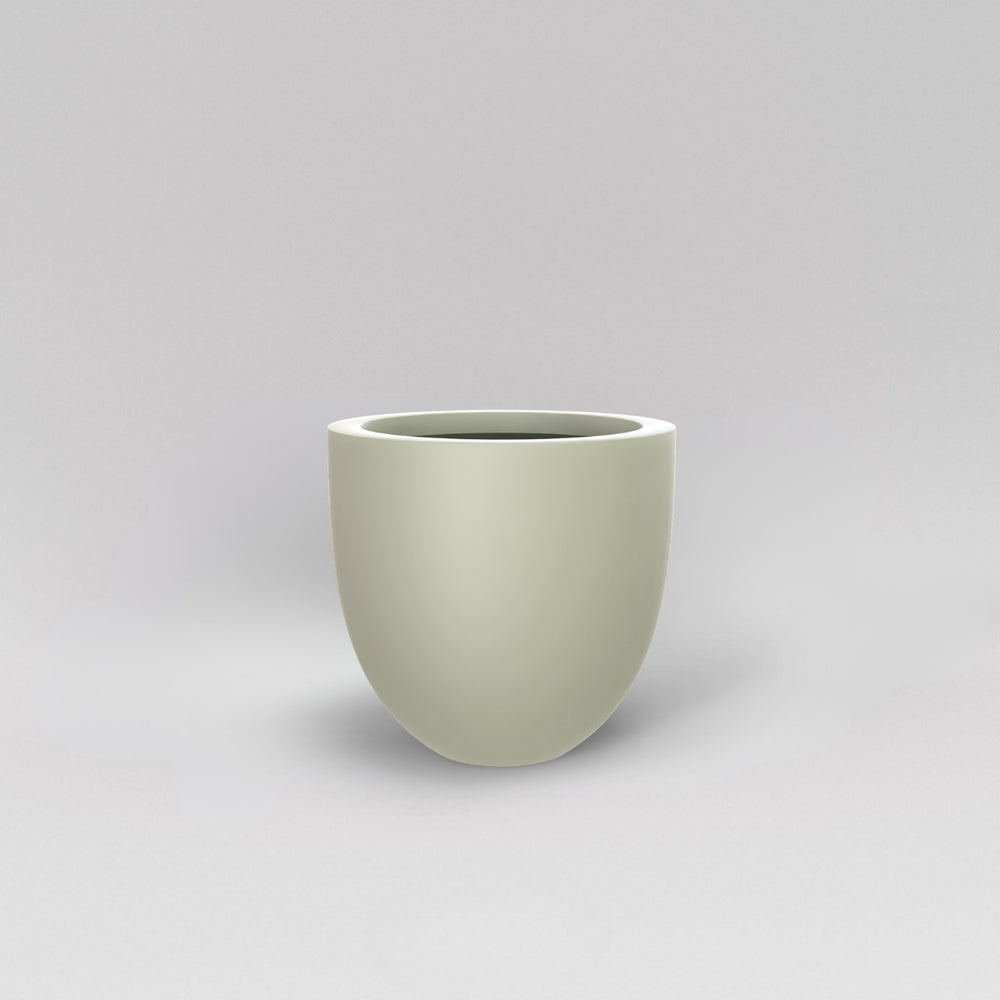 Alzira Round Fiberglass Planter in satin beige against gray background.