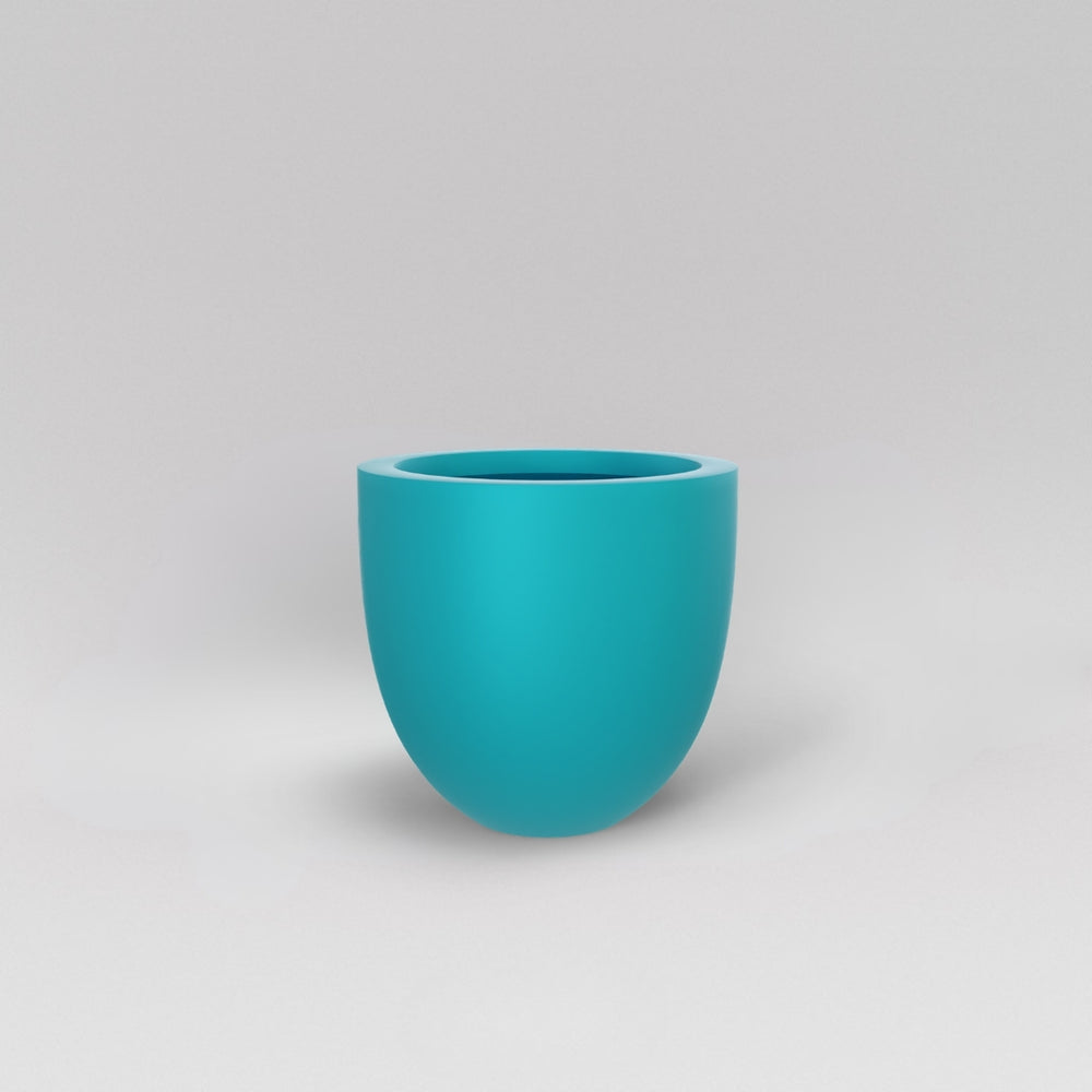 Alzira Round Fiberglass Planter in satin seafoam green against gray background.