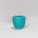 Alzira Round Fiberglass Planter in satin seafoam green against gray background.