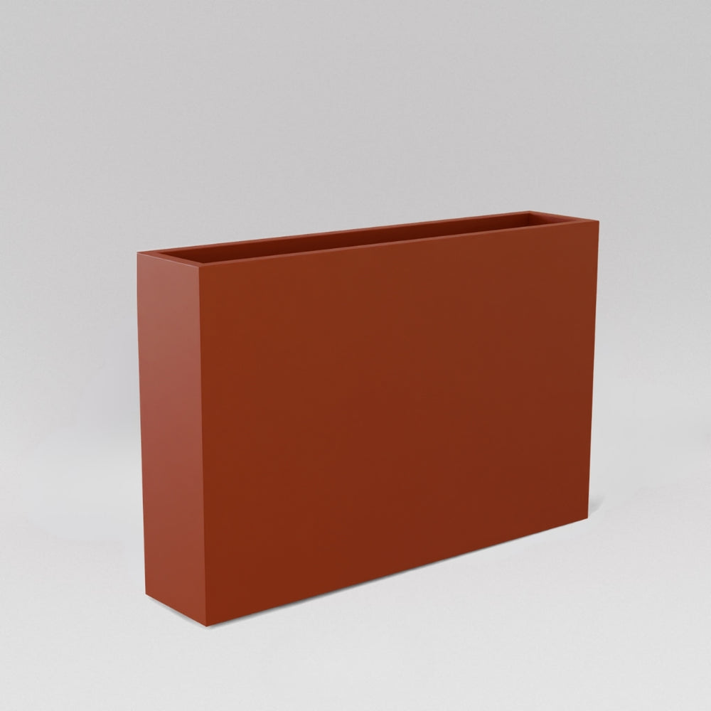 Amesbury Narrow Rectangle Planter in matte terra cotta against gray background.