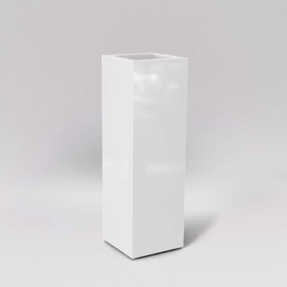 Amesbury Tall Corner Planter in gloss bright white against gray background.