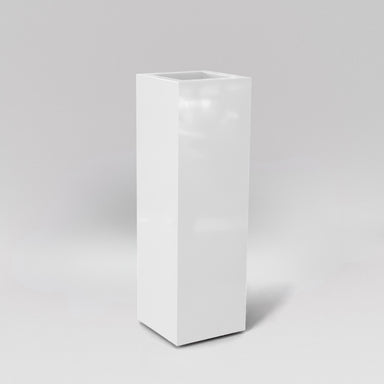 Amesbury Tall Corner Planter in gloss bright white against gray background.