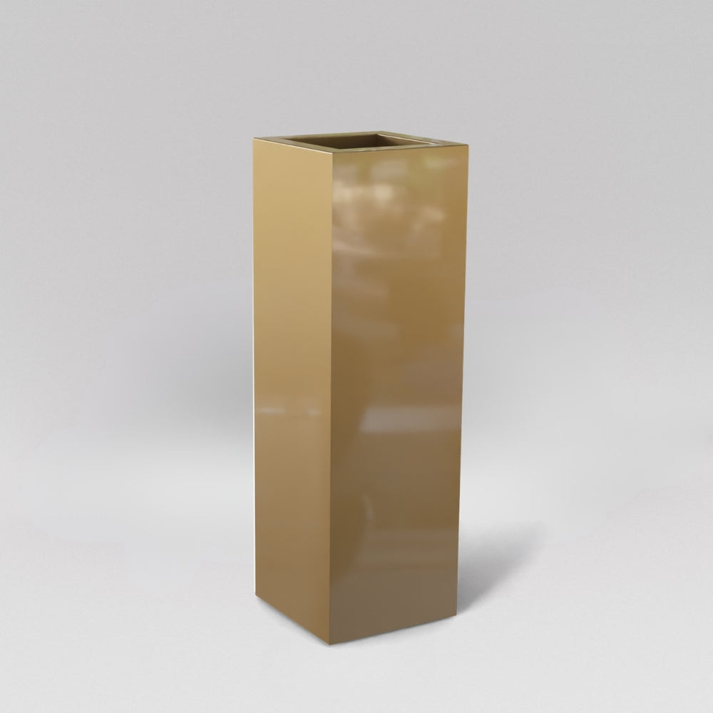 Amesbury Tall Corner Planter in gloss metallic gold against gray background.