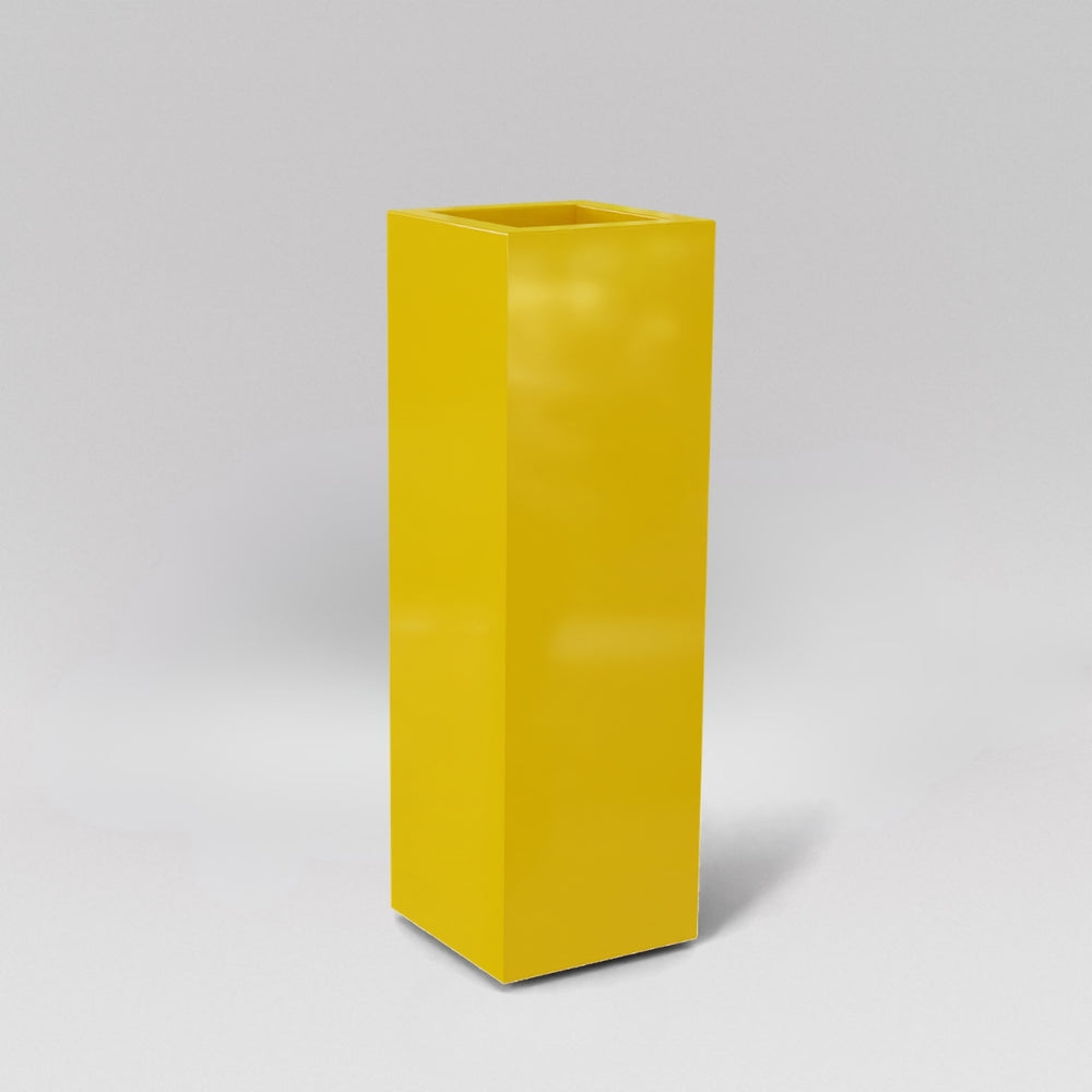 Amesbury Tall Corner Planter in gloss saffron against gray background.