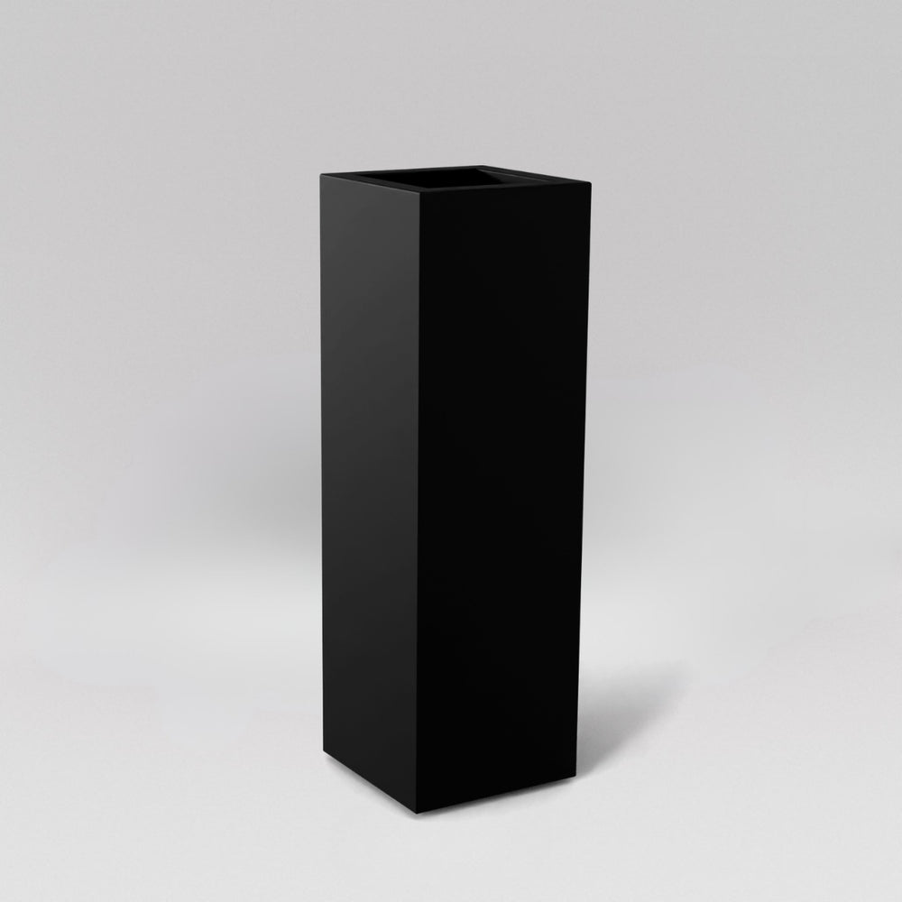 Amesbury Tall Corner Planter in matte black against gray background.