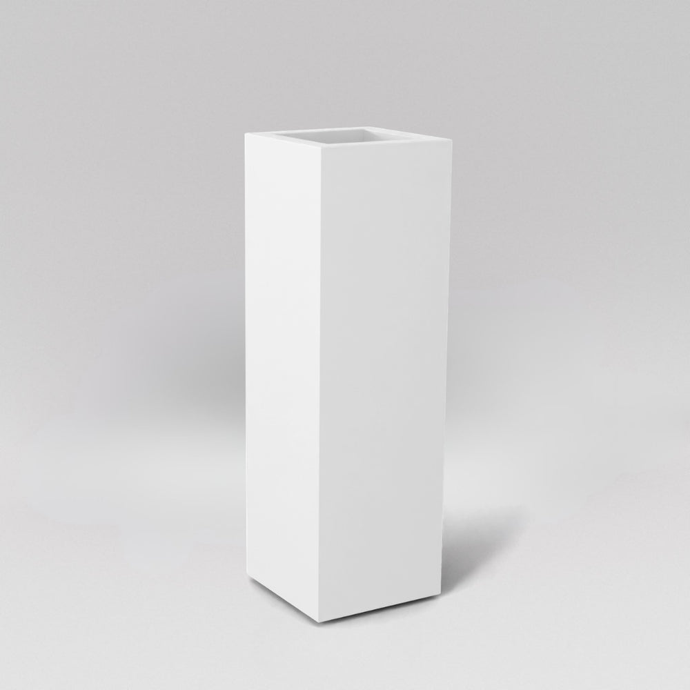 Amesbury Tall Corner Planter in matte bright white against gray background.