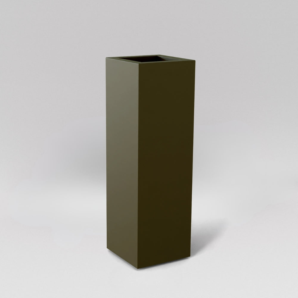 Amesbury Tall Corner Planter in matte bronze against gray background.