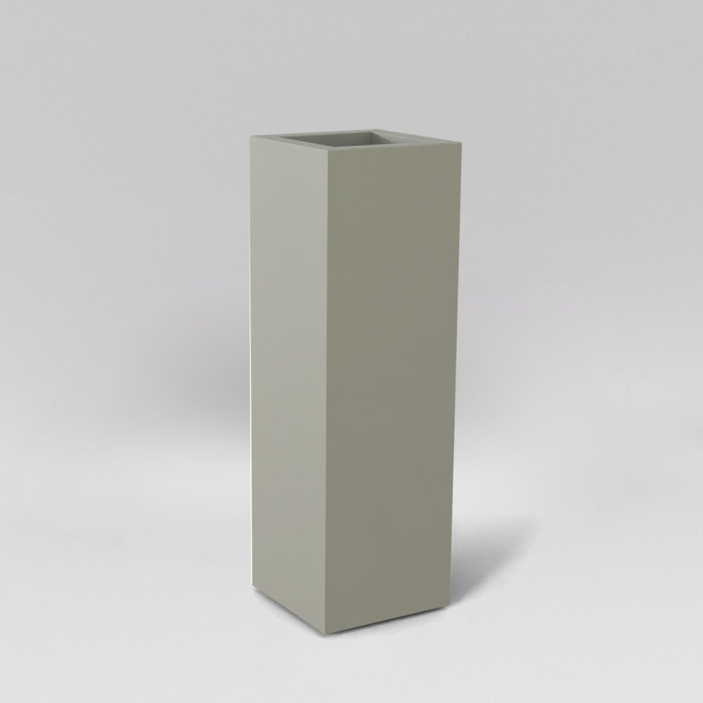 Amesbury Tall Corner Planter in satin beige against gray background.