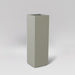 Amesbury Tall Corner Planter in satin beige against gray background.