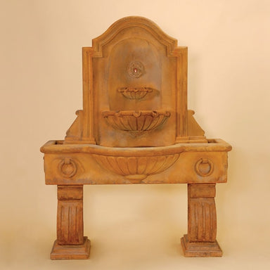 Anduze Wall Fountain, Tall against brown background.