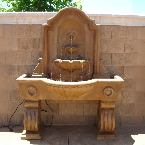 Anduze Wall Fountain, Tall on concrete in action.