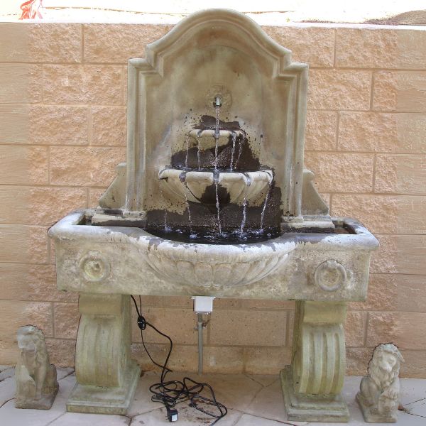 Anduze Wall Fountain, Tall on concrete in the backyard. 