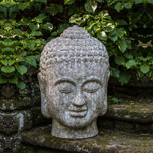 Angkor Buddha head large angkor grey in the backyard