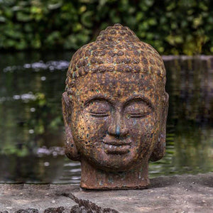 Angkor Buddha Head Large on concrete near river