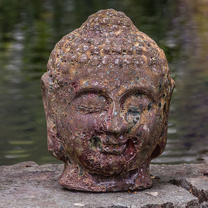 Angkor Buddha Head Small on concrete near river