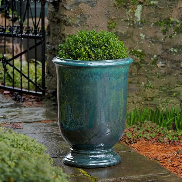 Antibe Urn - Indigo Rain - S/1 on concrete filled with plants