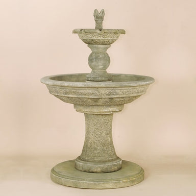 Antiquarium Two Tier Fountain against brown background.